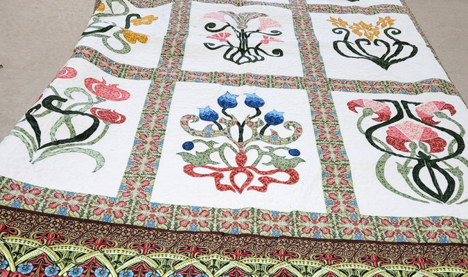 Maeola's Flora embroidered quilt, quilted by Joyce Dempsey