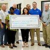 Pictured: Kenneth Graves, Coach Justin Russell, Jeff Radar, Shawanna Wansley, Dr. Lynne Dardenne, Energy Efficiency Consultant Kirk Pierce, and Johnny Lockley